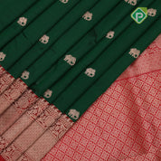 Forest green gold zari elephant butta contrast red rangoli mid mayilkan border banaras saree