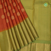 Honey orange gold zari big chakkaram butta contrast leaf green gold zari rangoli border Traditional silk saree