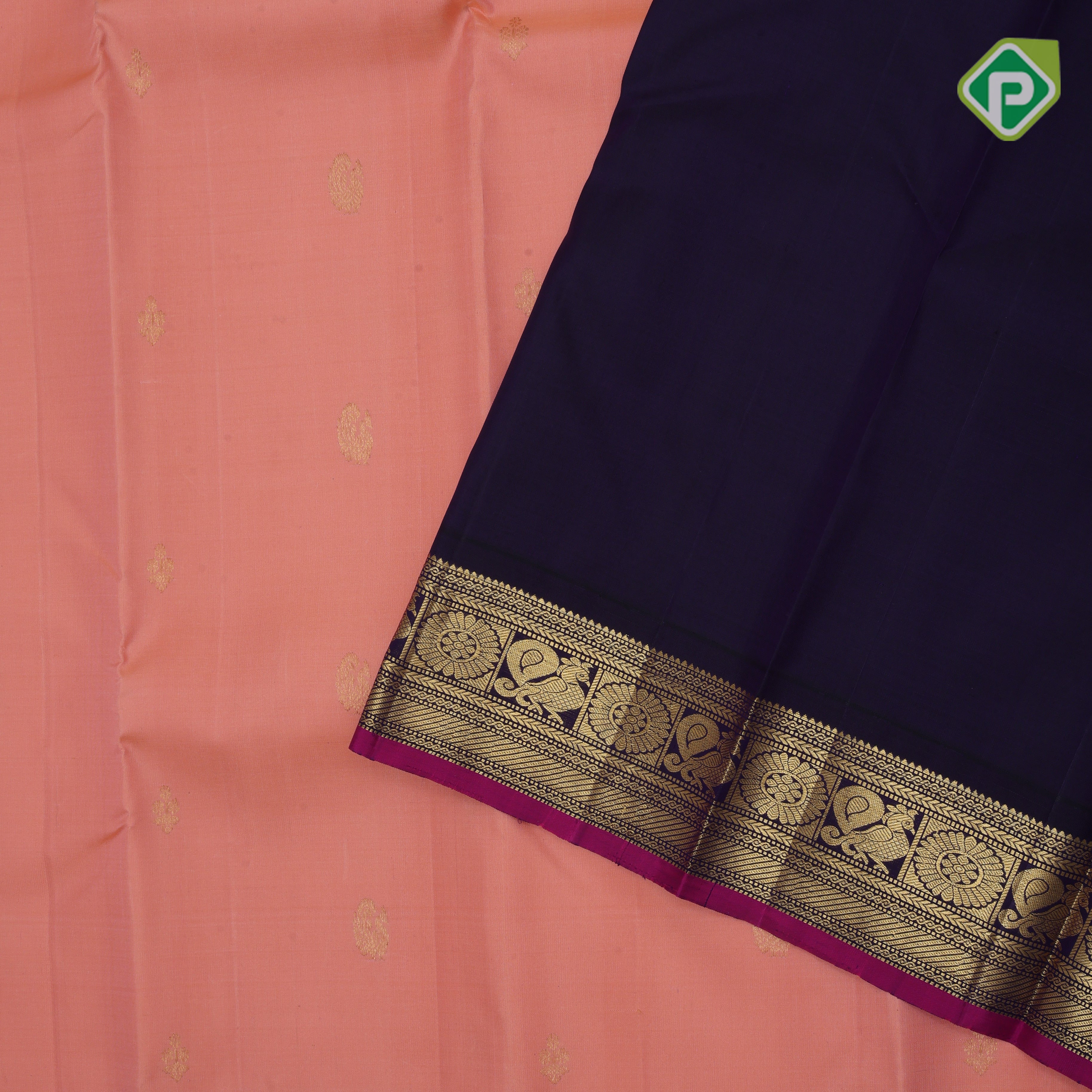 Peach gold zari peacock and flower butta design contrast blue gold zari peacock chakram border Traditional silk saree