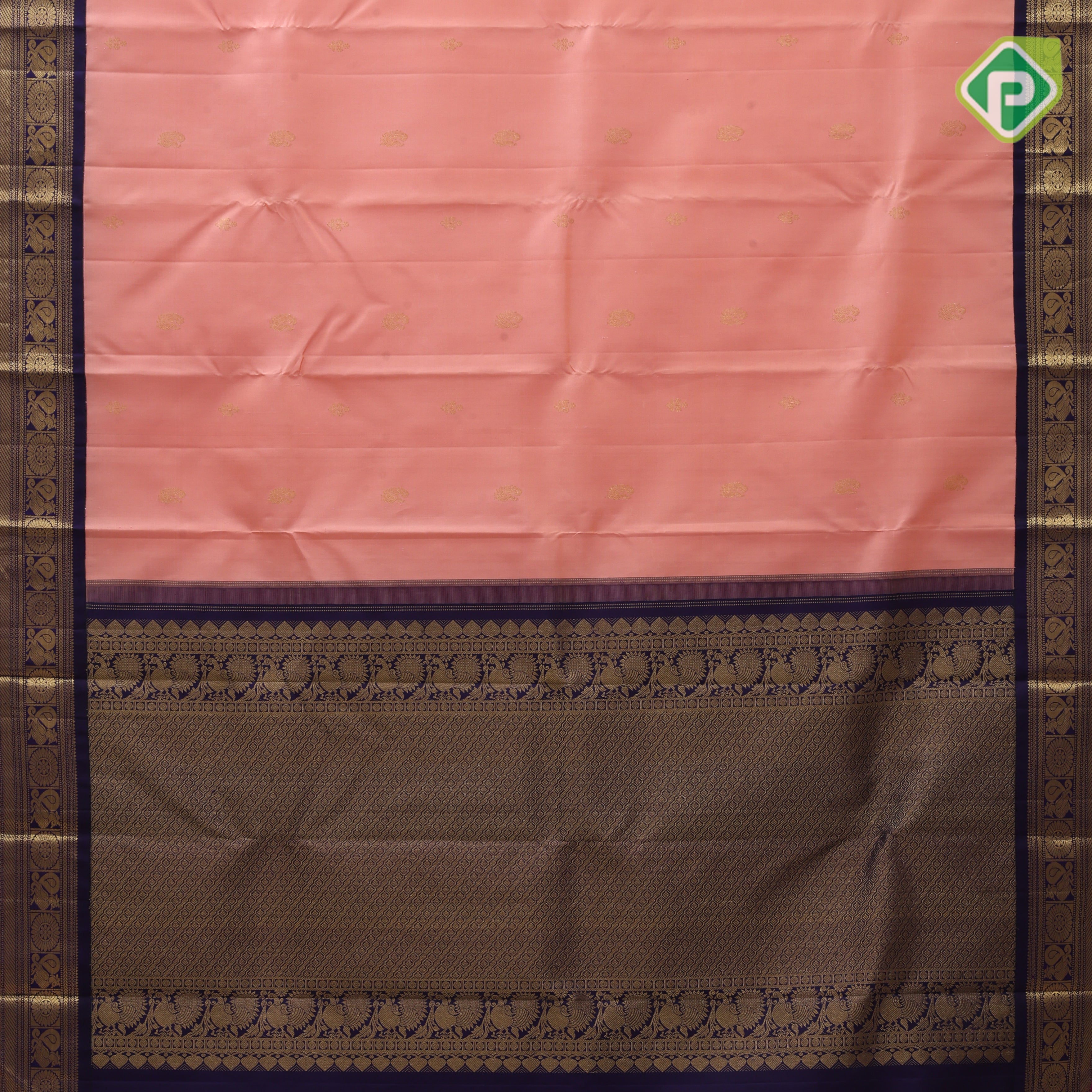 Peach gold zari peacock and flower butta design contrast blue gold zari peacock chakram border Traditional silk saree