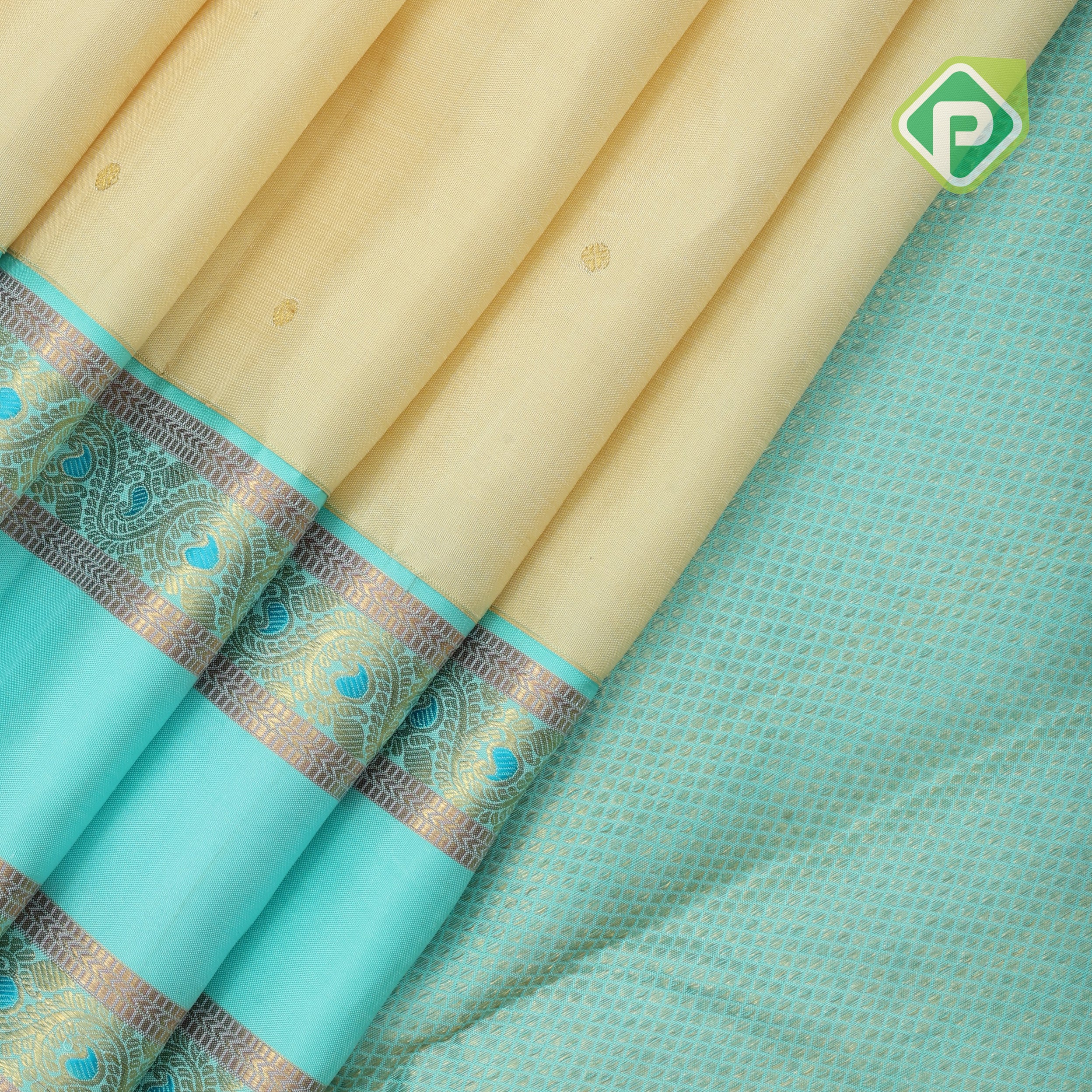 creamy sandal gold zari small round butta contrast sea blue rettapet border traditional silk saree