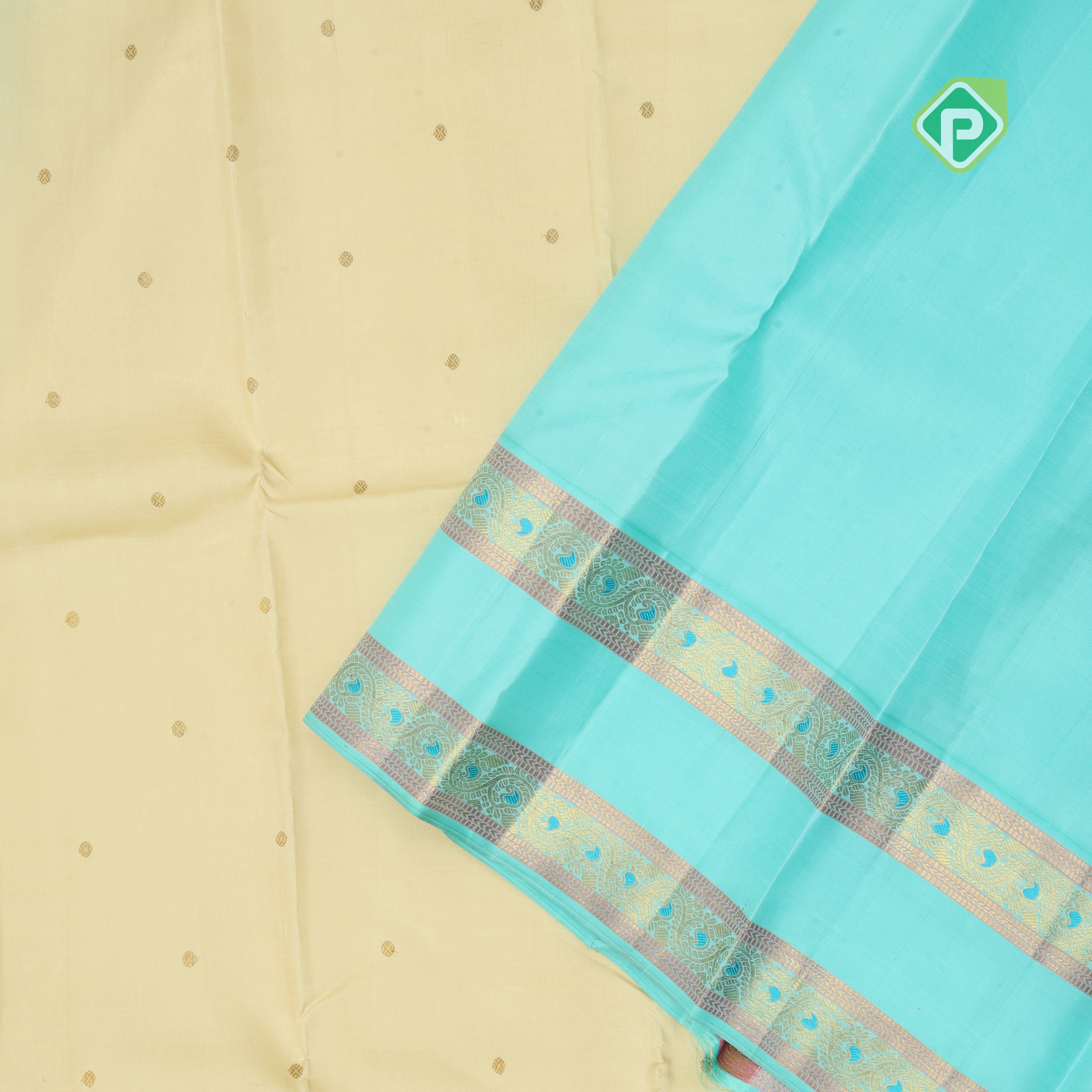 creamy sandal gold zari small round butta contrast sea blue rettapet border traditional silk saree