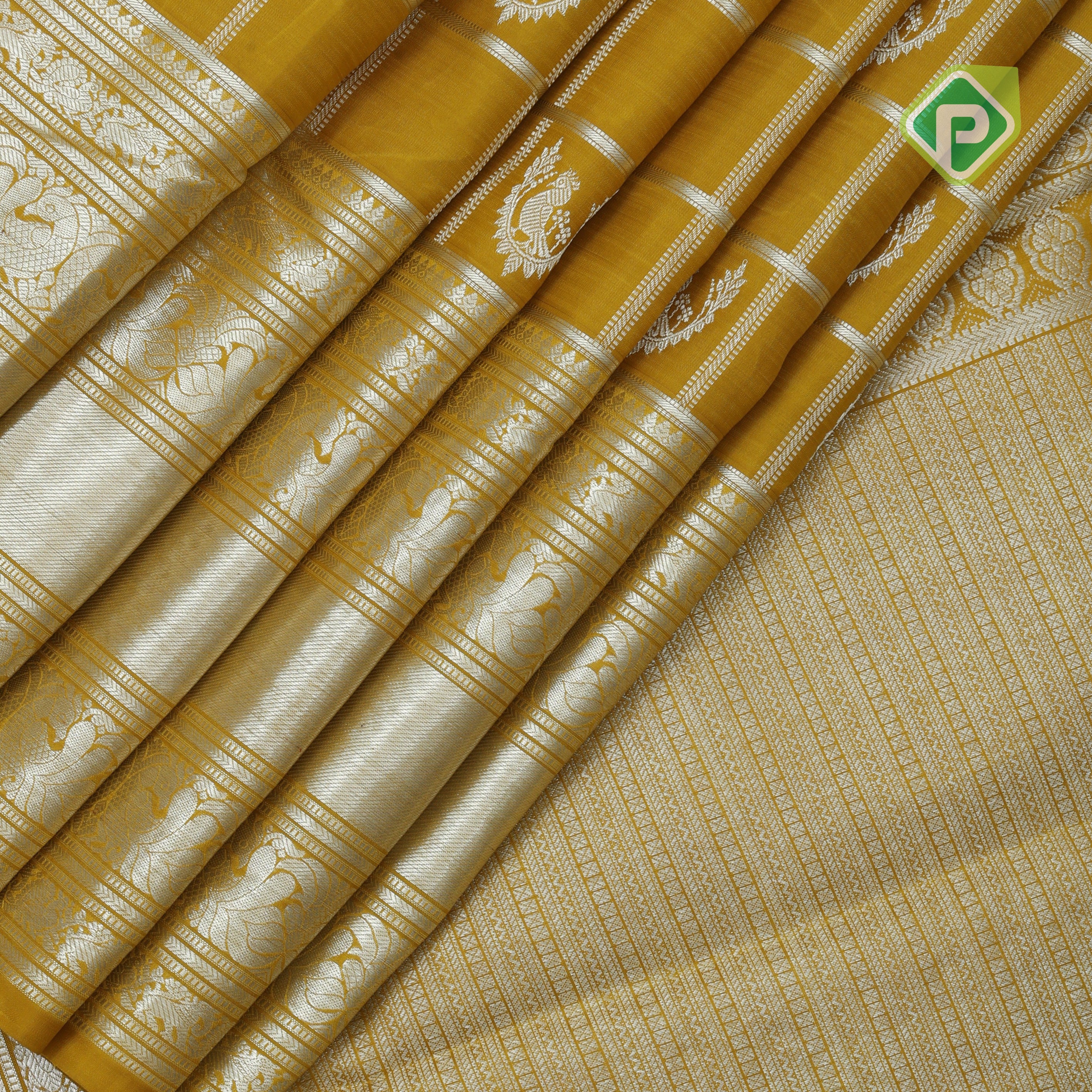 Lemon yellow silver zari checked window mid butta self zari peacock lines border traditional silk saree