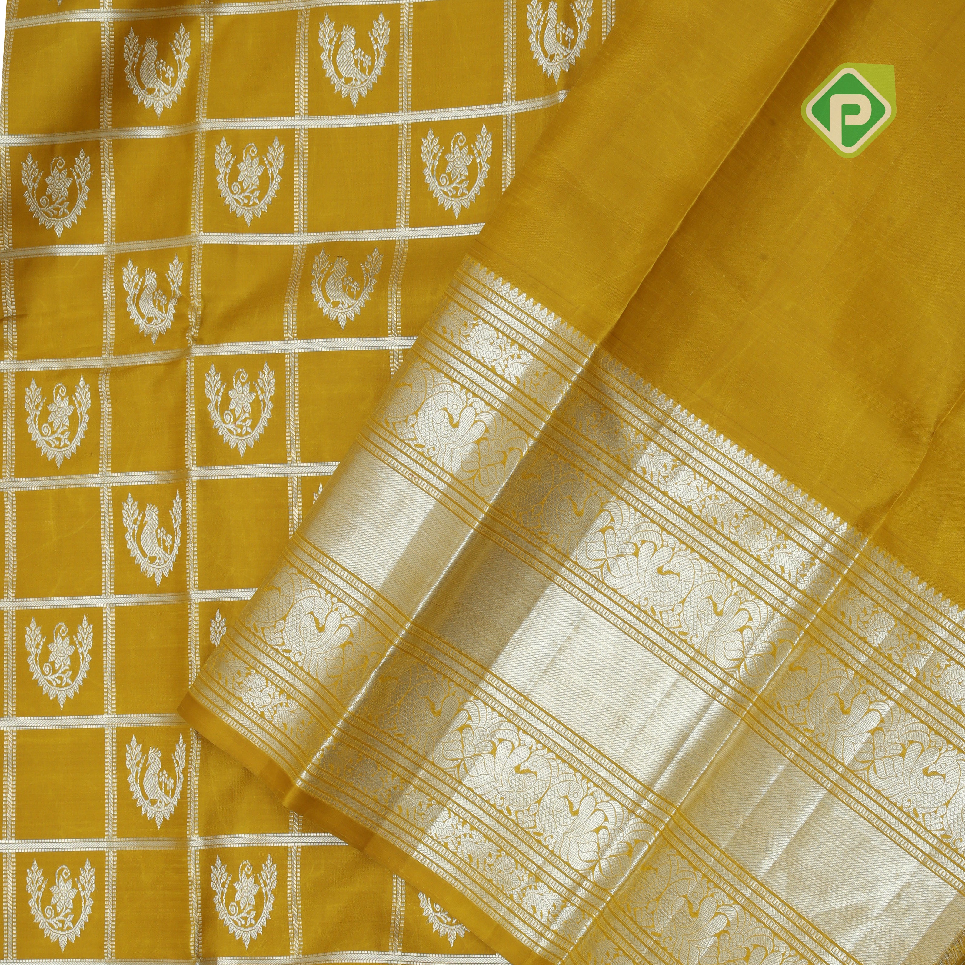 Lemon yellow silver zari checked window mid butta self zari peacock lines border traditional silk saree