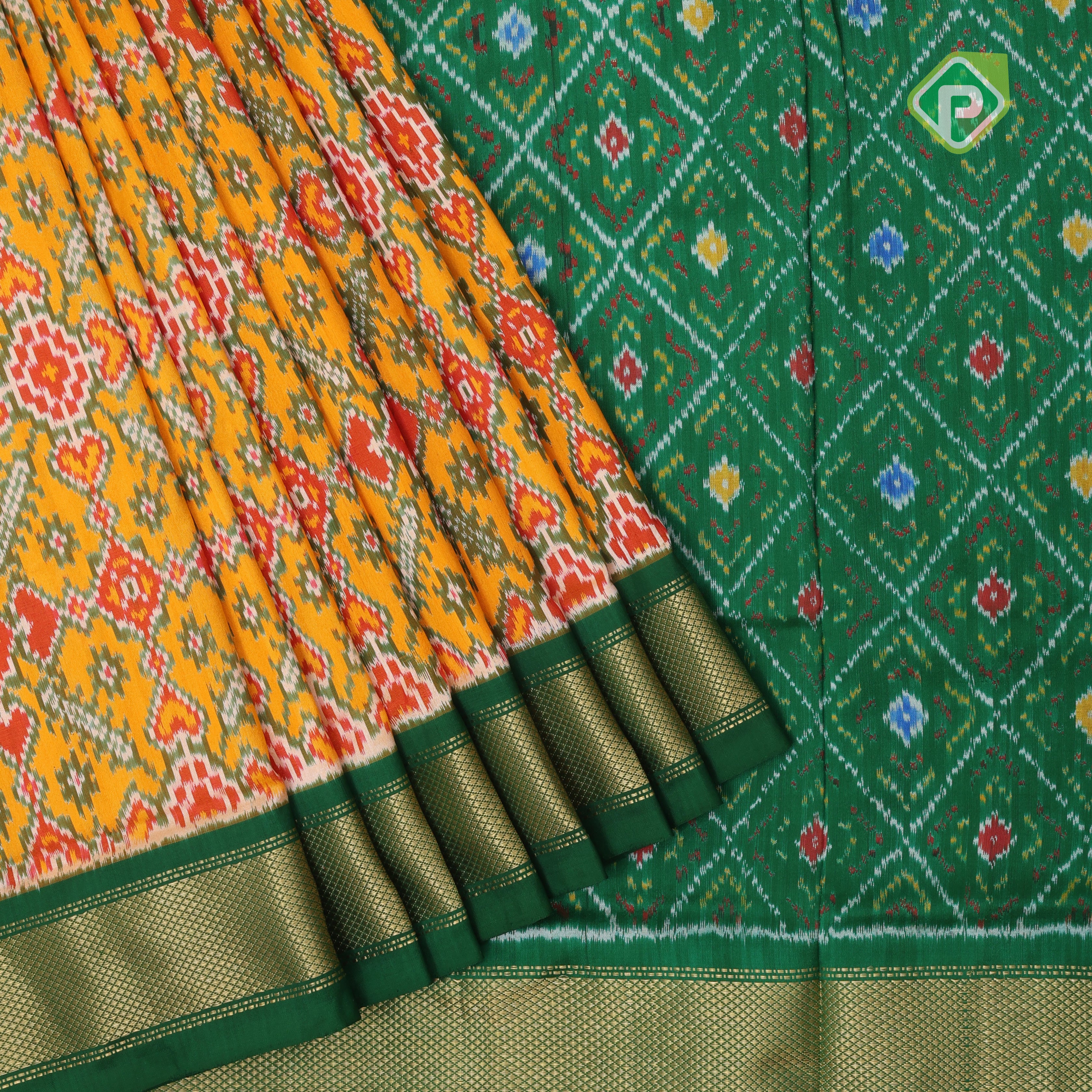 yellow base multi color ikkat design contrast green gold zari diamond border ikkat silk saree