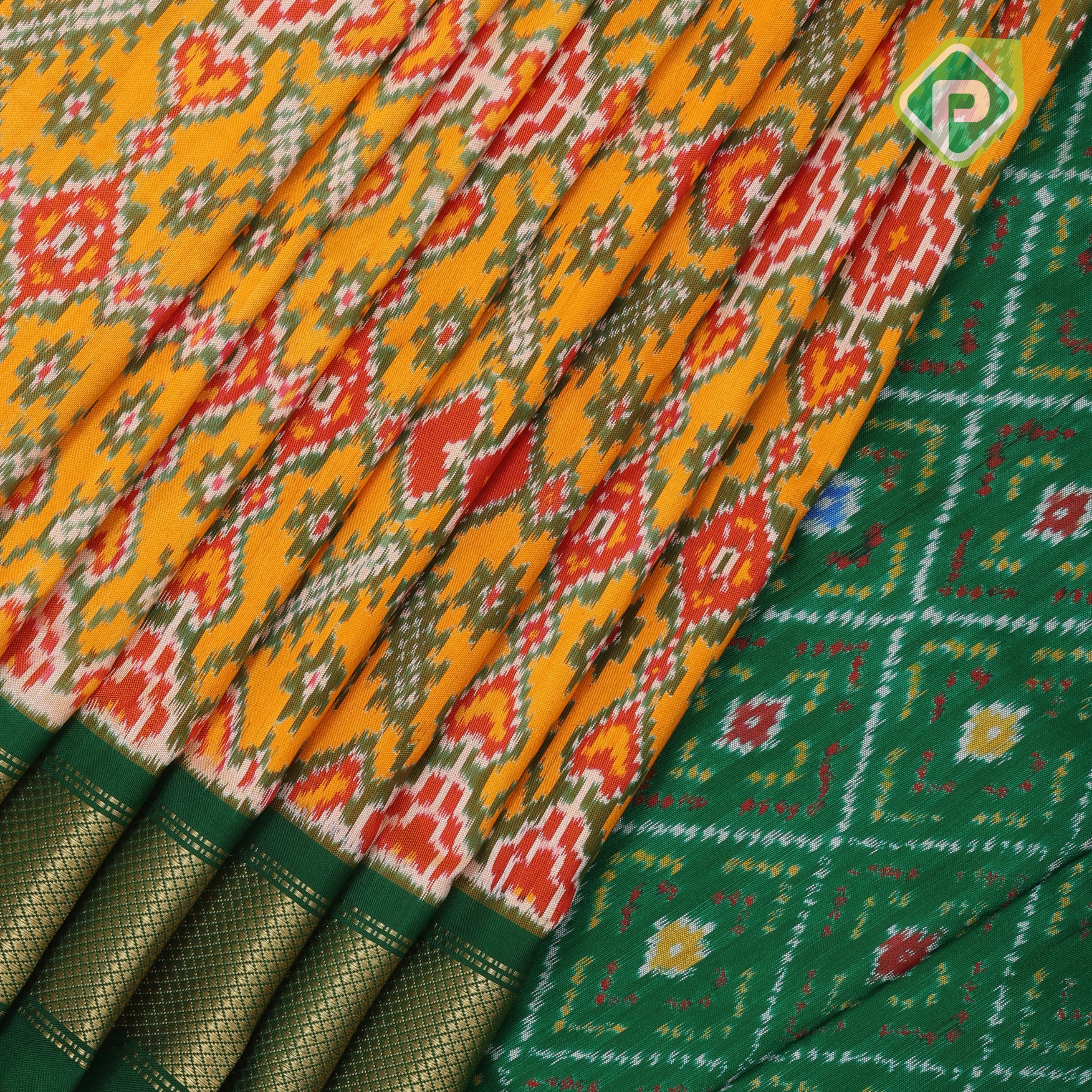 yellow base multi color ikkat design contrast green gold zari diamond border ikkat silk saree