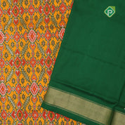 yellow base multi color ikkat design contrast green gold zari diamond border ikkat silk saree