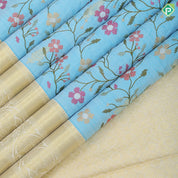 Sky blue multi color floral creeper embroidered design sandal gold zari Rangoli mid retta pattai border embroidery silk saree