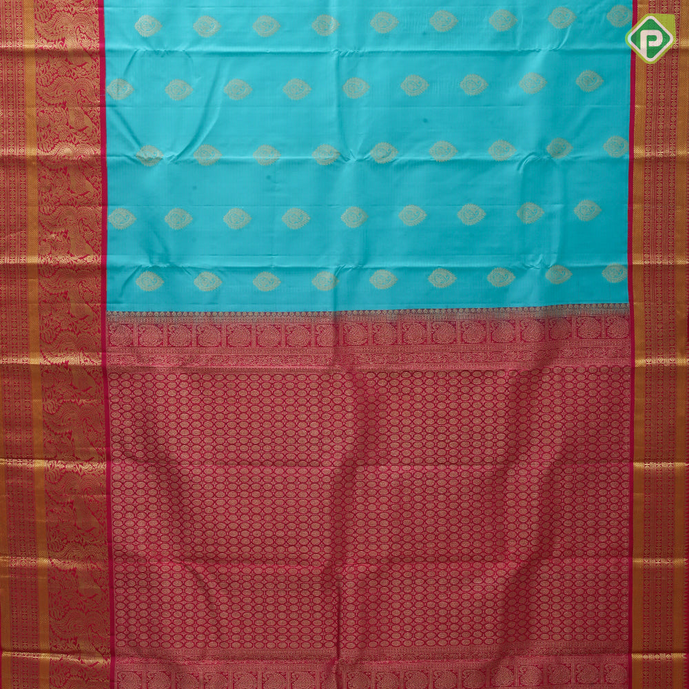 Sea green gold zari thilagam butta contrast pink gold zari peacock border traditional silk saree