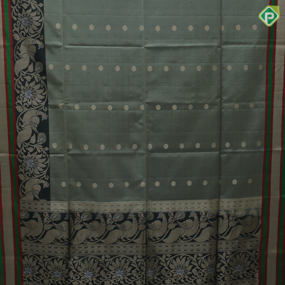 Tea green gold zari chakkaram butta motifs olive green rangoli multi color lines mid gold zari border soft silk saree