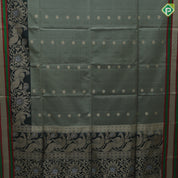 Tea green gold zari chakkaram butta motifs olive green rangoli multi color lines mid gold zari border soft silk saree
