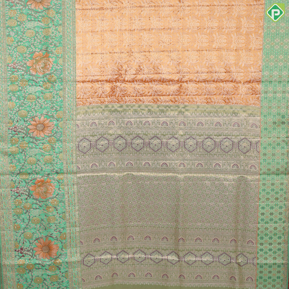 Honey orange silver zari floral creeper design contrast parrot green border grand bridal tissue silk saree