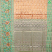 Honey orange silver zari floral creeper design contrast parrot green border grand bridal tissue silk saree