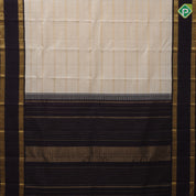 Milk white gold zari velthari design coffee brown peacock floral border design traditional silk saree