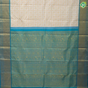 White gold zari annam chakkaram butta checks design peacock green gold zari zig zag stripes border bridal silk saree
