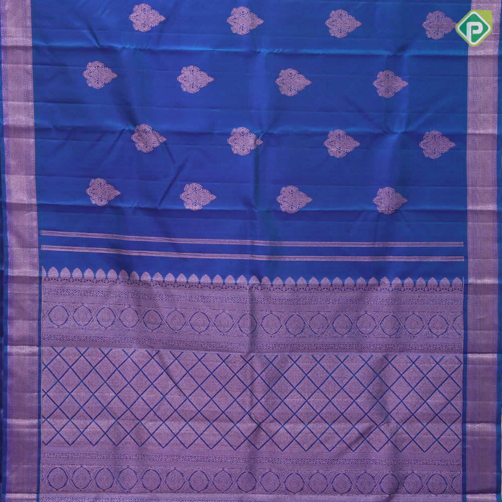 Peacock blue copper zari fancy thilagam butta design self color copper zari spinning edge border traditional silk saree