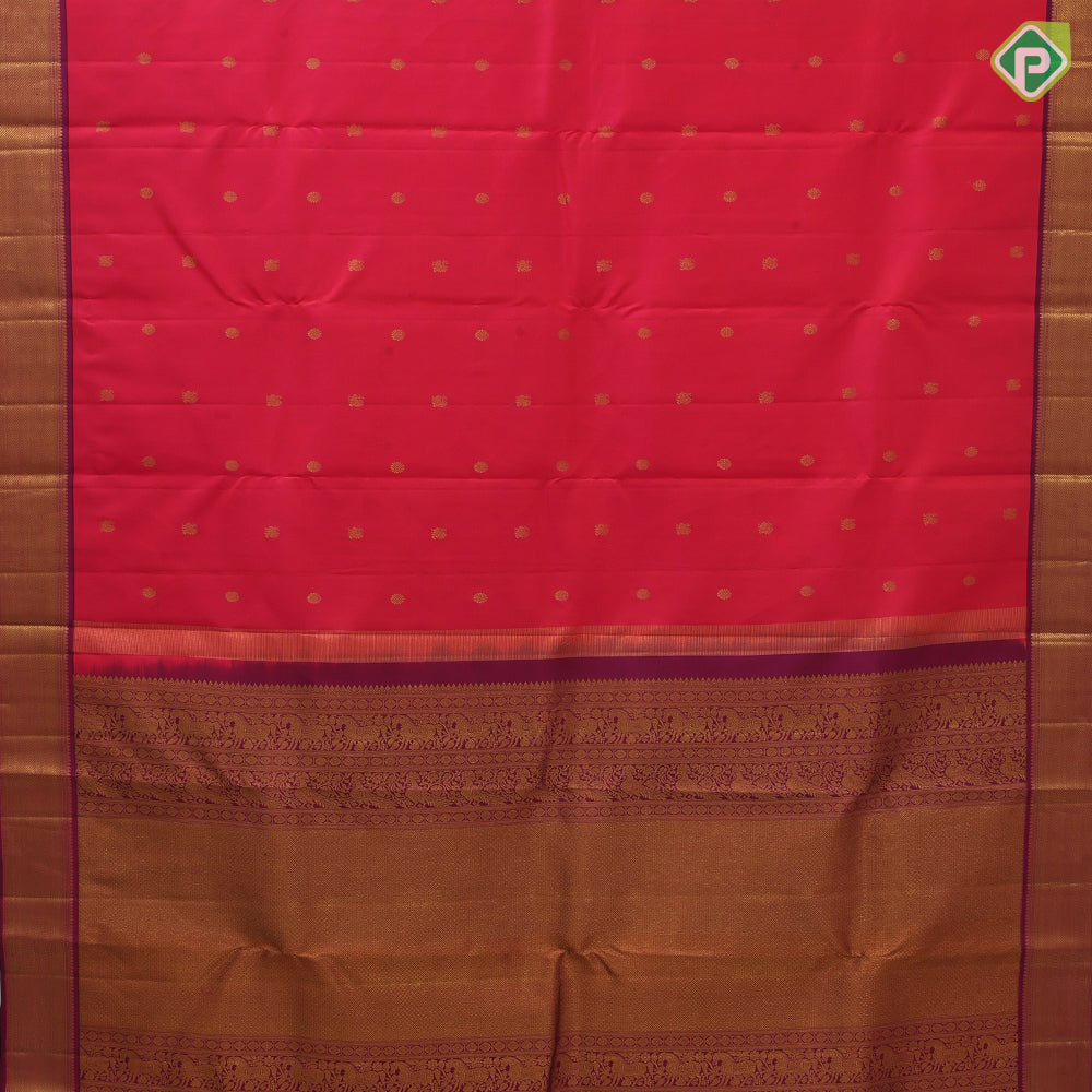 Rani pink gold zari peacock chakaram design purple wave border design traditional silk saree