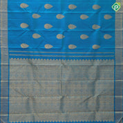Peacock blue gold zari self designed thilagam butta self color gold zari edge border traditional silk saree