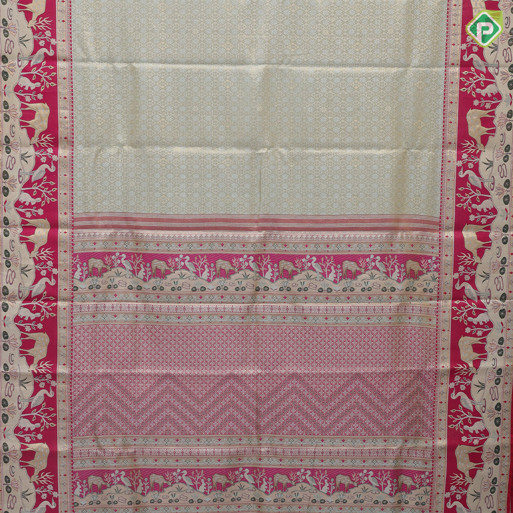 Mint green silver gold zari geometrical brocade design contrast rani pink gold zari wild effect pythonic design border grand tissue silk saree