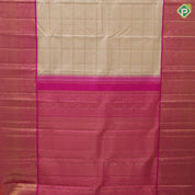 creamy sandal gold zari grand buttas filled checks contrast pink gold zari double peacock arch design border grand bridal silk saree
