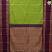 parrot green gold zari  peacock checks design  purple colour vairaoosi peacock and mango border design traditional silk saree
