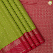 Parrot green gold zari checks and kamalam butta rani pink gold zari border art silk saree