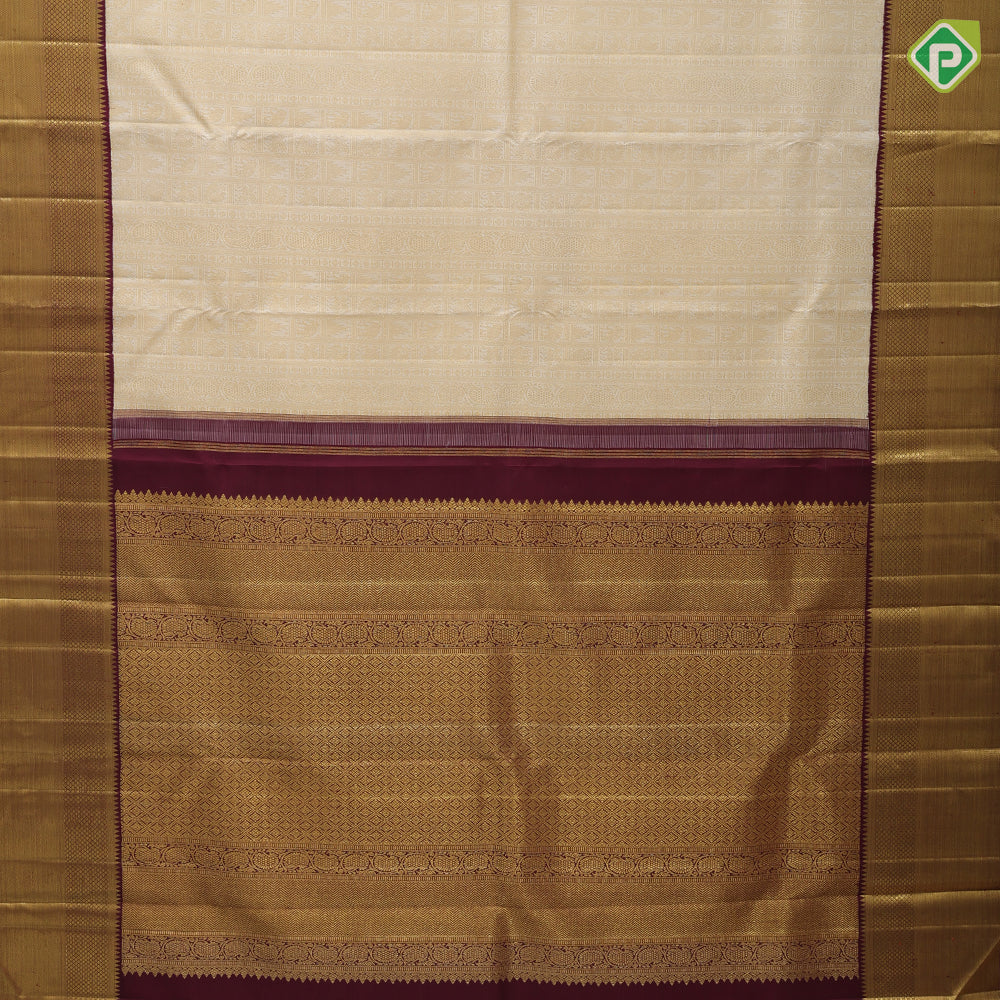White gold zari hundred design buttas maroon gold zari partial bavanji border exclusive bridal silk saree