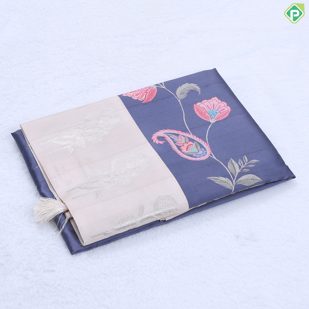 Violet with multi color floral creeper design contrast cream with silver zari flower border semi tusser saree