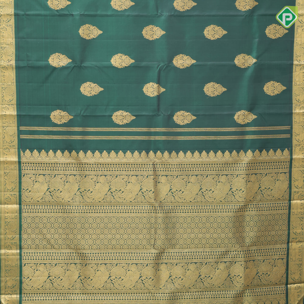 Bottle green gold zari fancy thilagam butta design self color gold zari peacock elephant butts edge border traditional silk saree