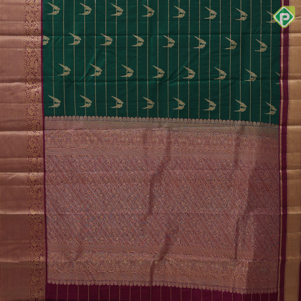 bottle green gold zari velthari lines double parrot butta purple gold zari vanasingaram border traditional silk saree