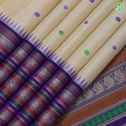Sandal cream with multi color thread butta motifs Blue base multi color design border traditional silk saree