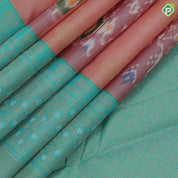 Peach base gold zari heart butta and ikkat design rexona green gold zari floral korvai border fusion silk saree