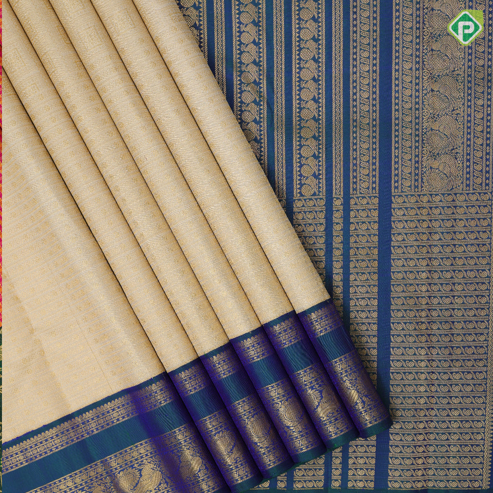 creamy sandal gold zari velthari and checks design peacock blue gold zari peacock butta retta pett border traditional silk saree