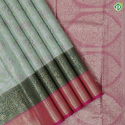 Pista green silver zari and multi color floral design contrast double color center border tissue art silk saree