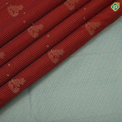 Rust color gold zari stripes and flower creeper butta sea blue gold zari peacock butta border art silk saree