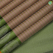 cream colour shades with silver gold zari thread work lines contrast leaf green silver gold zari fancy annam butta border traditional silk saree