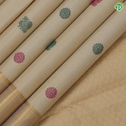 Sandal and multi color silk thread peacock chakkaram butta self gold zari and green edge border traditional silk saree