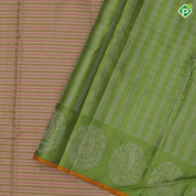 cream colour shades with silver gold zari thread work lines contrast leaf green silver gold zari fancy annam butta border traditional silk saree