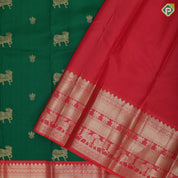 Green with gold zari cow and lotus butta design reddish pink silver gold zari cow and lotus lines border traditional silk saree