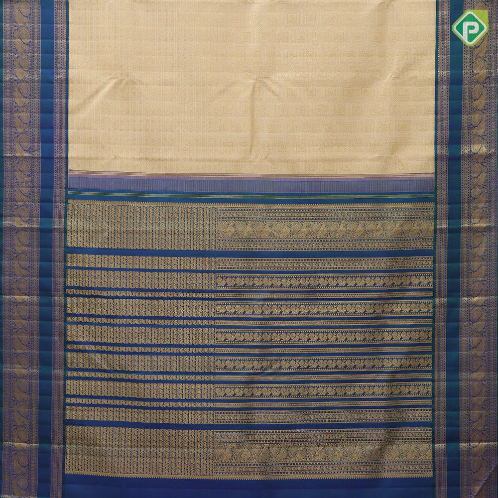 creamy sandal gold zari velthari and checks design peacock blue gold zari peacock butta retta pett border traditional silk saree