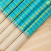 green tri colour shades classic checks design creamy sandal gold zari retta pattai border retro traditional silk saree