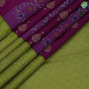 Purple base gold zari heart butta and ikkat design contrast green gold zari floral korvai border fusion silk saree