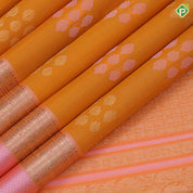 Fanta orange silver gold zari grouped butta design pale pink gold zari peacock and kamadhenu border organza silk saree