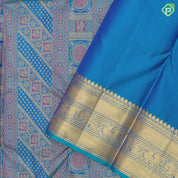 Peacock green base gold zari and multi color multi design self gold zari multi design line border grand bridal silk saree
