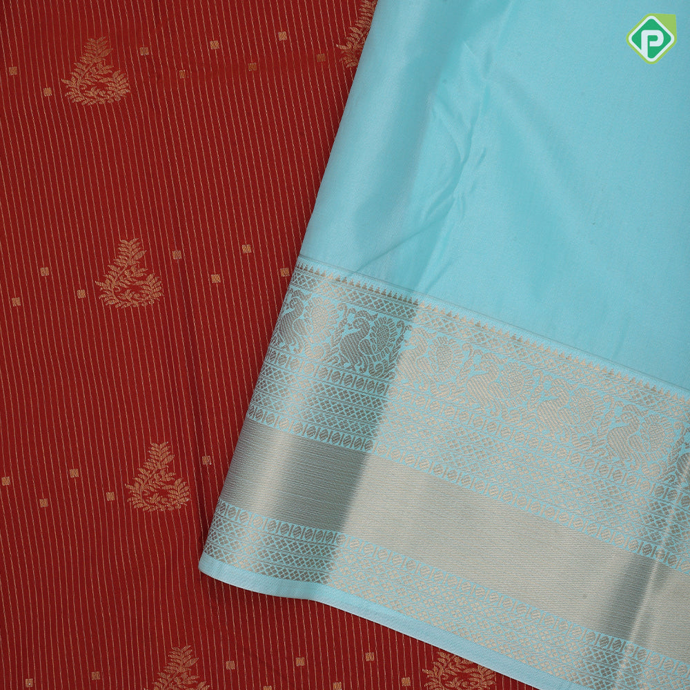 Rust color gold zari stripes and flower creeper butta sea blue gold zari peacock butta border art silk saree