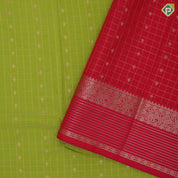 Parrot green gold zari checks and kamalam butta rani pink gold zari border art silk saree