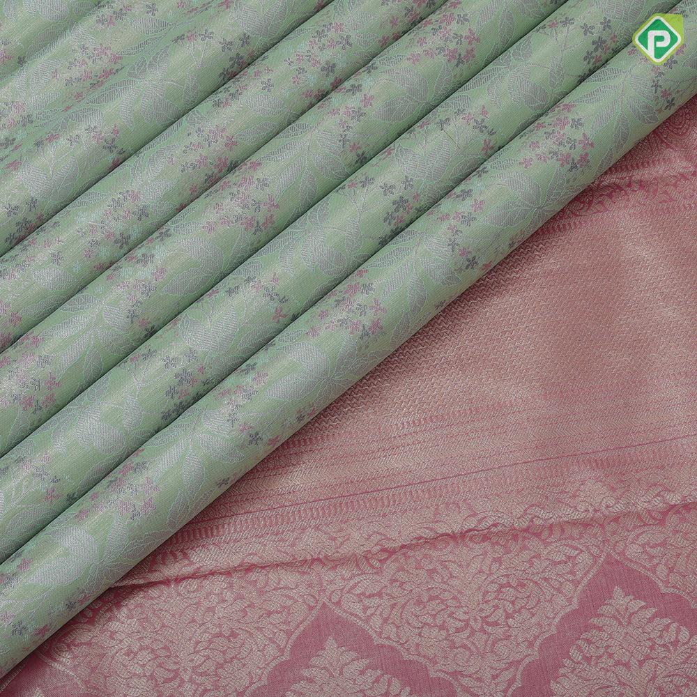 Pista green silver zari and multi color floral design contrast double color center border tissue art silk saree