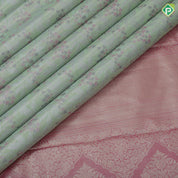 Pista green silver zari and multi color floral design contrast double color center border tissue art silk saree