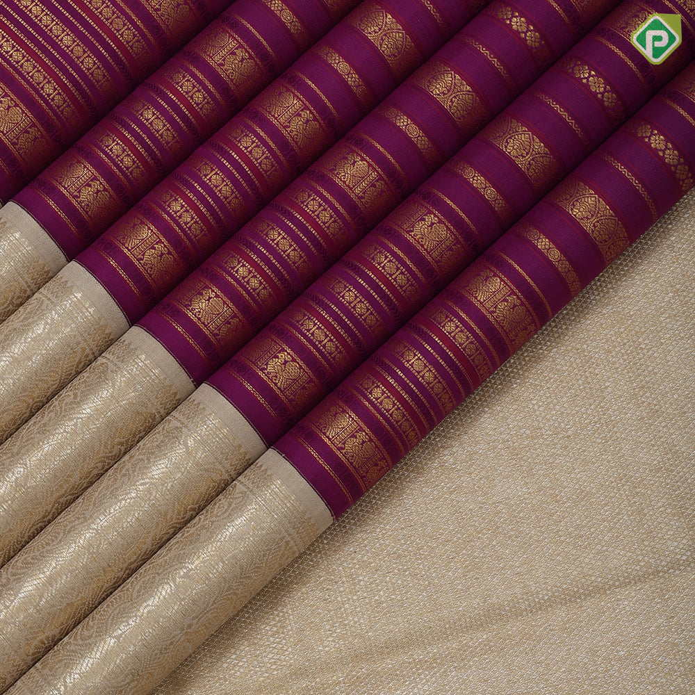 Purple base gold zari multi designed butta lines creamy sandal gold zari double peacock butta border bridal silk saree
