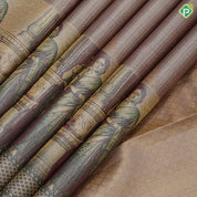 Mint green gold zari kattam checked round butta self thamayanthi stading posture art effect painting signature silk saree